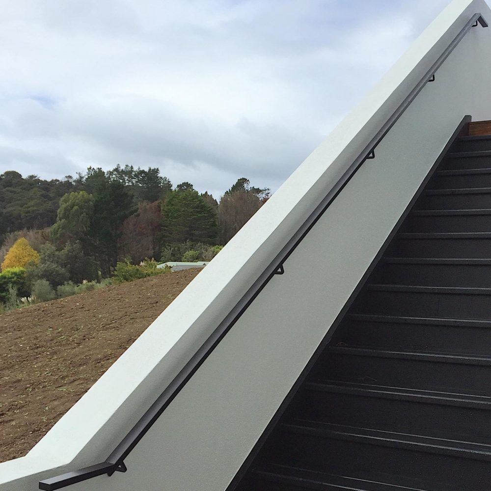 Custom mild steel handrail for exterior stairs by Fabricators, Firefish Fabrication, Auckland.