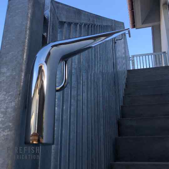 Image of a custom made stainless steel handrail at a residential home in Auckland. Bespoke fabrication experts, Firefish Fabrication.