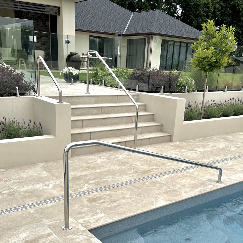 Image of multiple custom made stainless steel pool handrails at a residential home in Auckland.